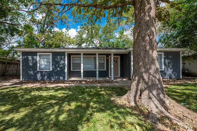 ranch-style house with a front lawn