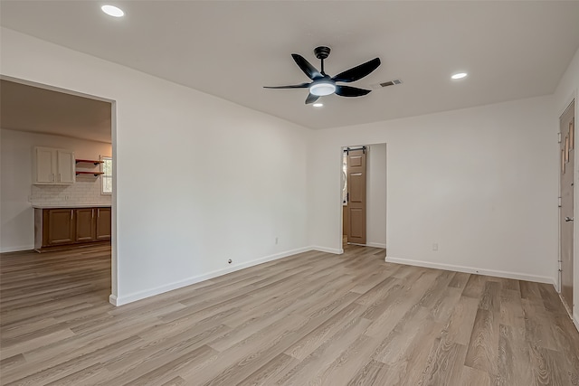 interior space with light hardwood / wood-style floors and ceiling fan