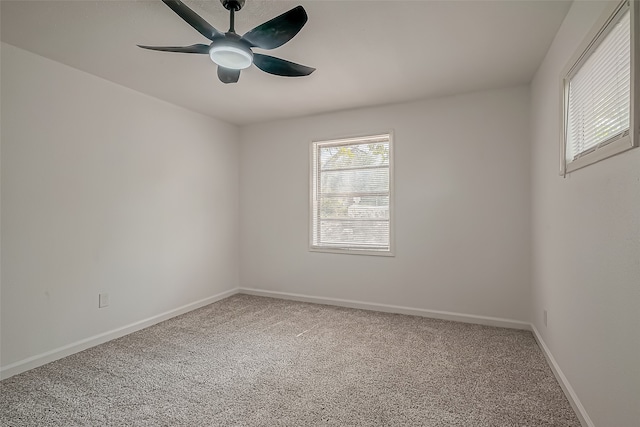 unfurnished room featuring carpet and ceiling fan