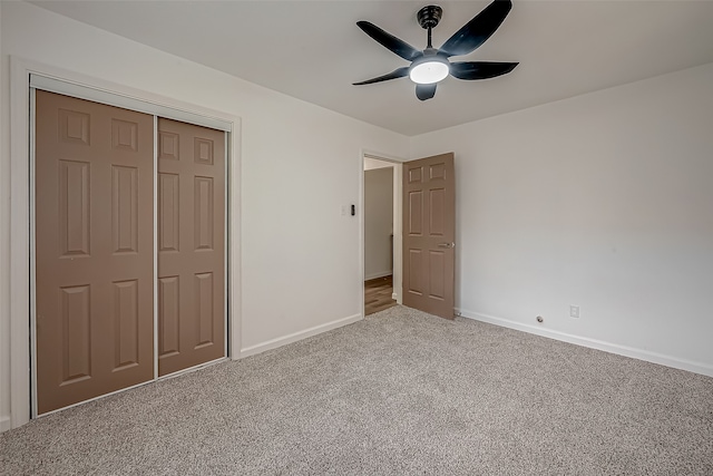 unfurnished bedroom featuring carpet flooring, a closet, and ceiling fan