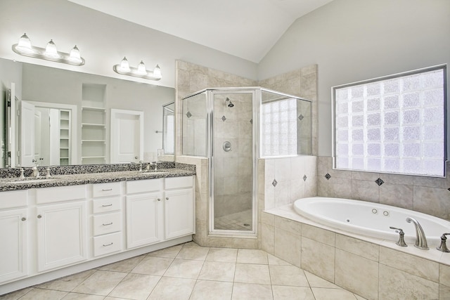 bathroom featuring separate shower and tub, tile patterned flooring, vanity, and vaulted ceiling