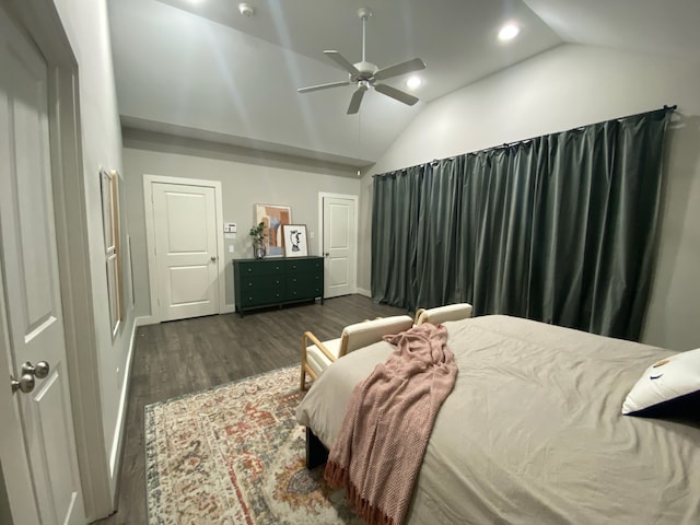 bedroom with dark hardwood / wood-style floors, vaulted ceiling, and ceiling fan