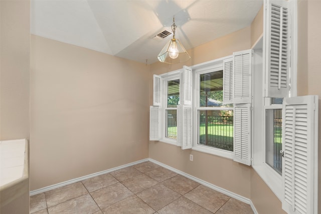 unfurnished dining area featuring light tile patterned floors