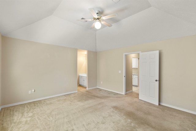 interior space with light carpet, lofted ceiling, and ceiling fan