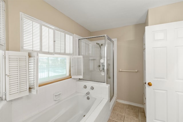 bathroom featuring plus walk in shower and tile patterned floors