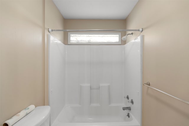 bathroom with toilet and shower / bath combination