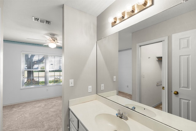 bathroom featuring ceiling fan and vanity