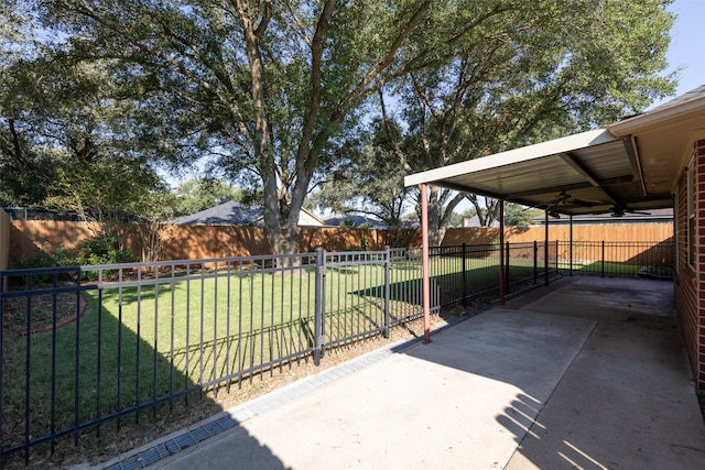 view of yard with ceiling fan and a patio area