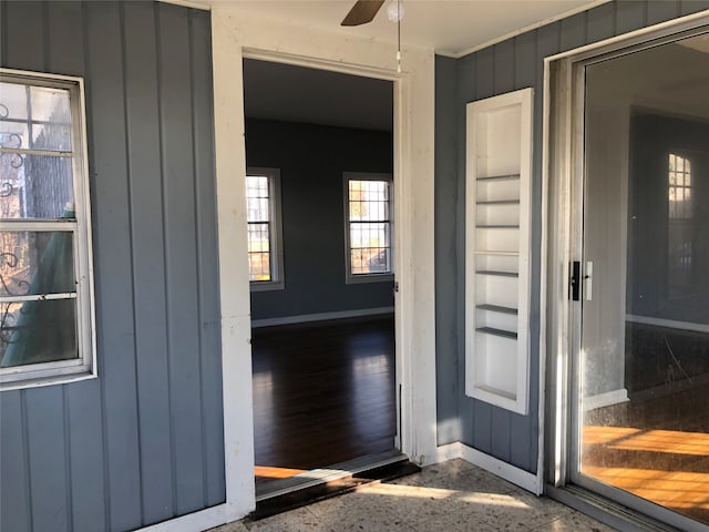 property entrance with ceiling fan