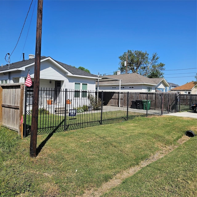 back of property featuring a lawn