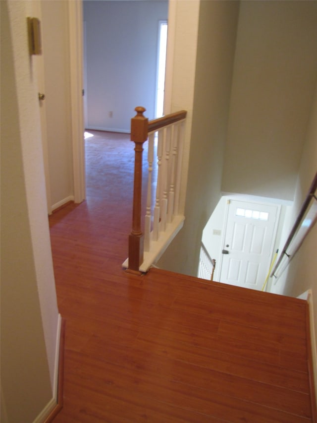 corridor with wood-type flooring