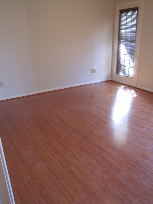 unfurnished room with light hardwood / wood-style flooring