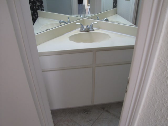 bathroom with vanity and tile patterned floors