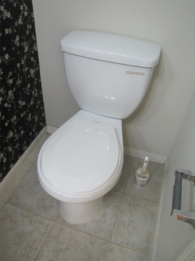 bathroom with tile patterned floors and toilet