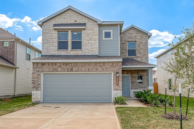 view of front of house featuring a garage and a front yard