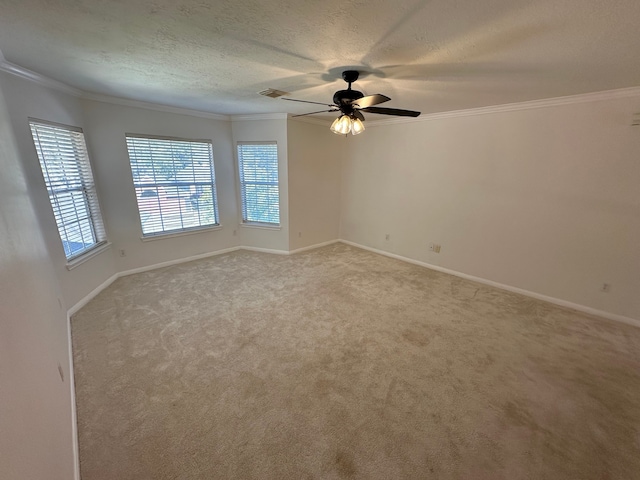 unfurnished room featuring a textured ceiling, light colored carpet, ceiling fan, and ornamental molding