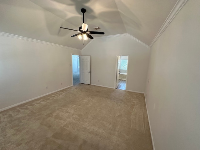 interior space featuring light colored carpet, vaulted ceiling, and ceiling fan