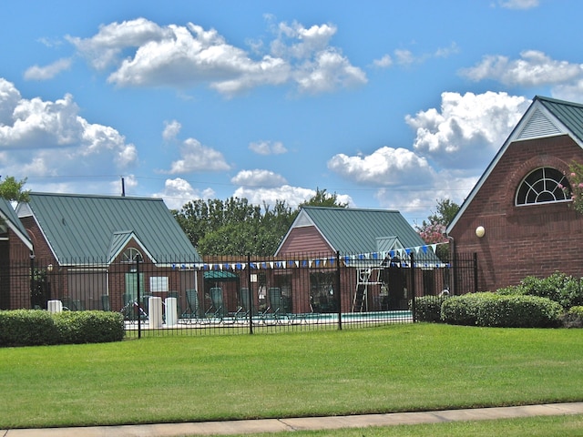 view of community featuring a yard