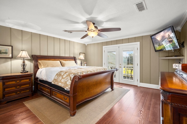 bedroom featuring dark hardwood / wood-style floors, access to exterior, crown molding, ceiling fan, and french doors