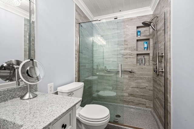 bathroom featuring crown molding, a shower with door, vanity, and toilet