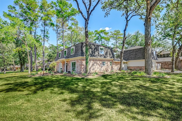 view of side of home featuring a lawn