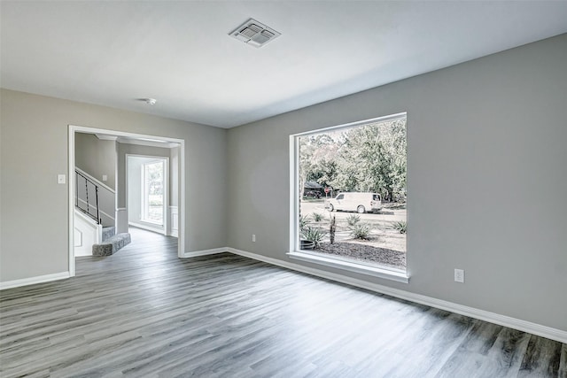 spare room with hardwood / wood-style floors