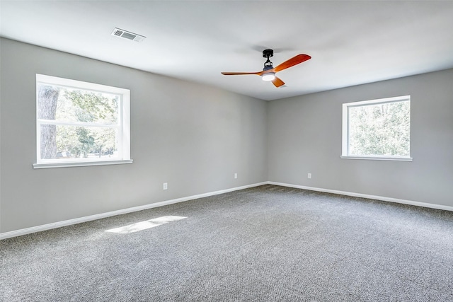 spare room with ceiling fan and carpet flooring