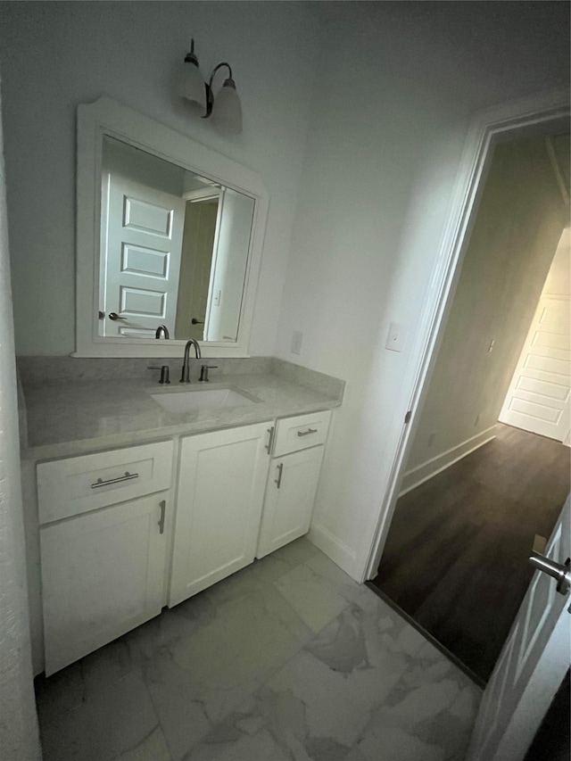 bathroom featuring vanity and wood-type flooring