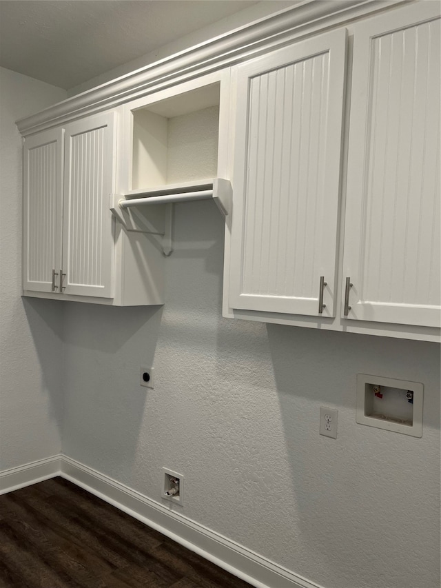 laundry area with hookup for an electric dryer, cabinets, dark hardwood / wood-style flooring, and hookup for a washing machine