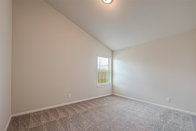 unfurnished room featuring high vaulted ceiling and carpet