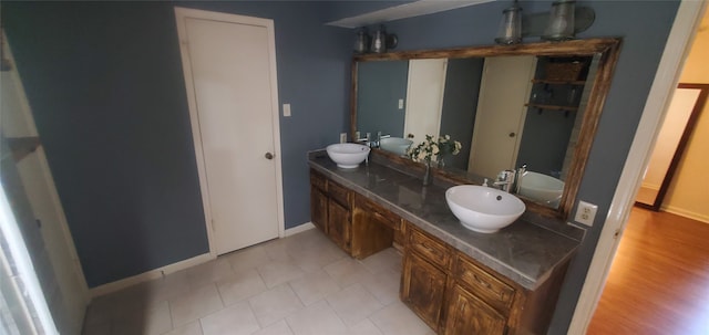 bathroom featuring vanity and hardwood / wood-style flooring