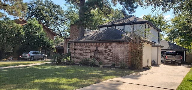 view of side of property featuring a lawn and a carport