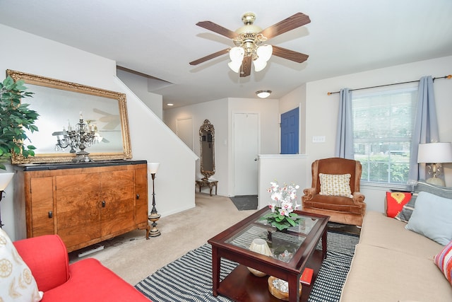 carpeted living room featuring ceiling fan