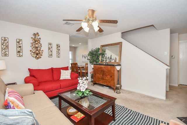 living room with light carpet and ceiling fan