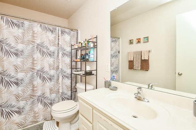 bathroom with vanity, toilet, and curtained shower