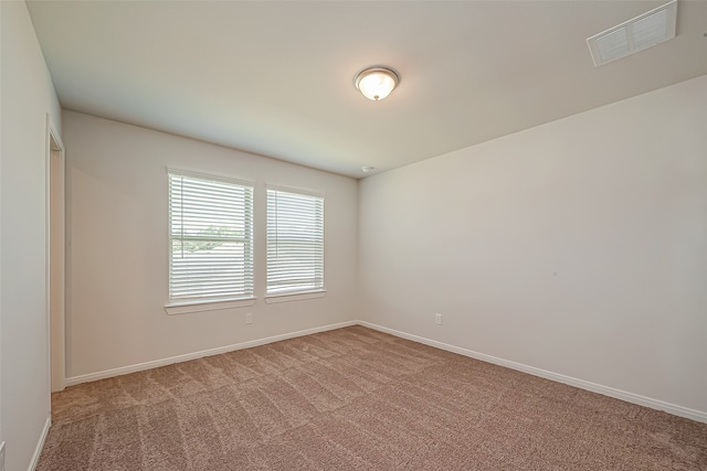 unfurnished room featuring carpet flooring