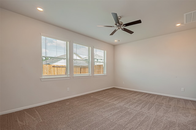 unfurnished room with carpet floors and ceiling fan