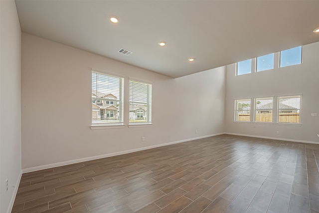 unfurnished room with wood-type flooring