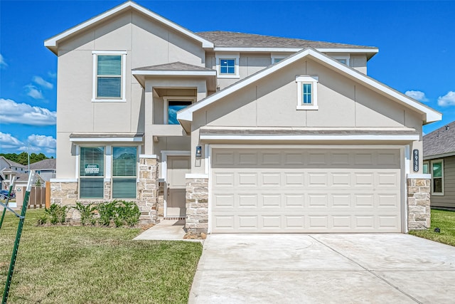 view of front facade with a garage and a front yard