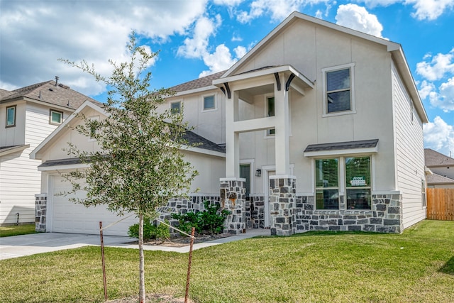 view of front of home featuring a garage and a front lawn