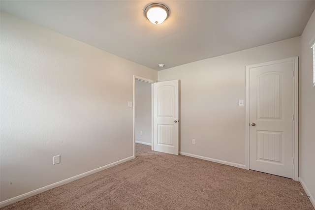 spare room featuring carpet flooring