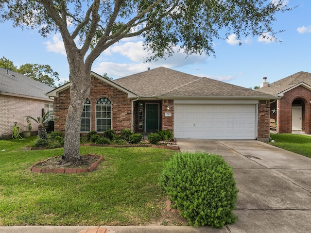 ranch-style house featuring a front yard and a garage