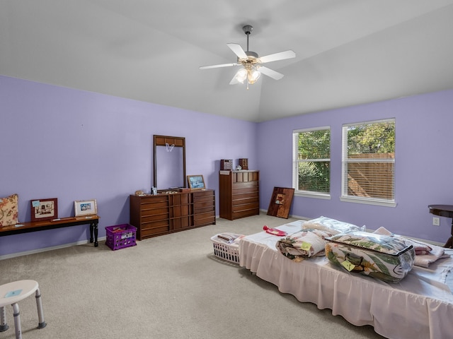 bedroom featuring vaulted ceiling, ceiling fan, and carpet floors