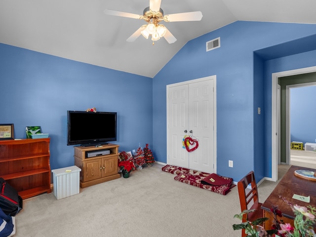 playroom featuring light carpet, vaulted ceiling, and ceiling fan