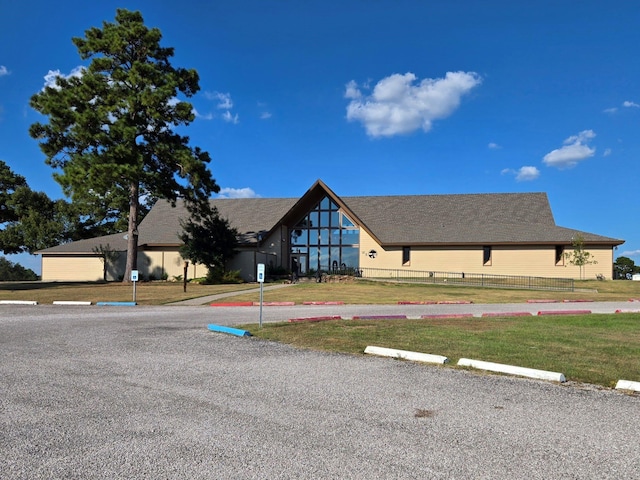 exterior space with uncovered parking and fence