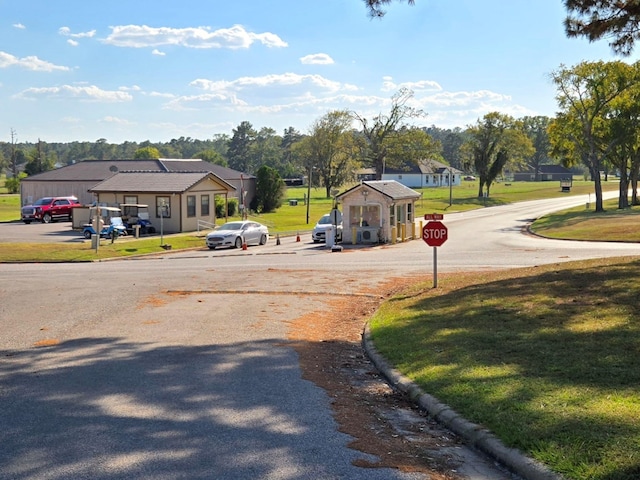 view of street featuring curbs and traffic signs