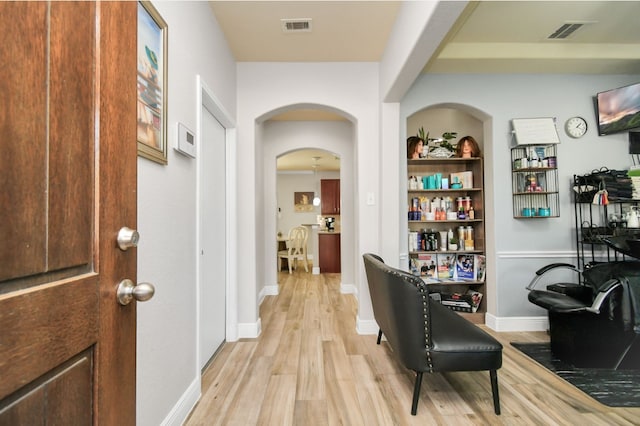 hallway featuring light wood-type flooring