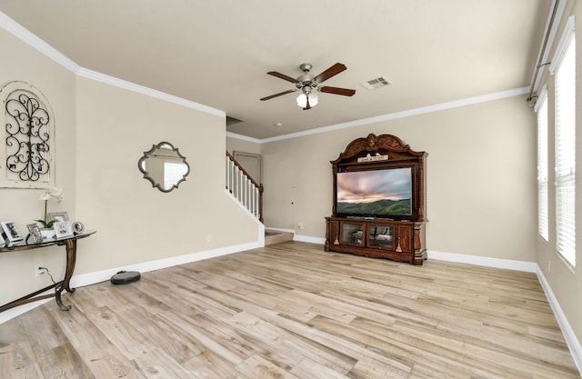 unfurnished living room featuring light wood-type flooring, crown molding, and ceiling fan