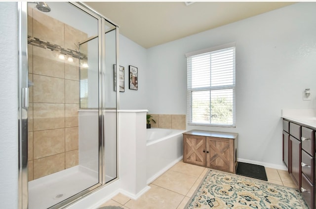 bathroom featuring tile patterned floors, independent shower and bath, and vanity