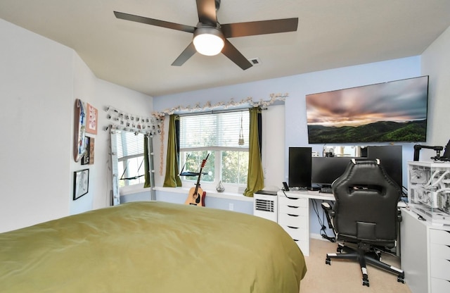 bedroom featuring ceiling fan and light colored carpet